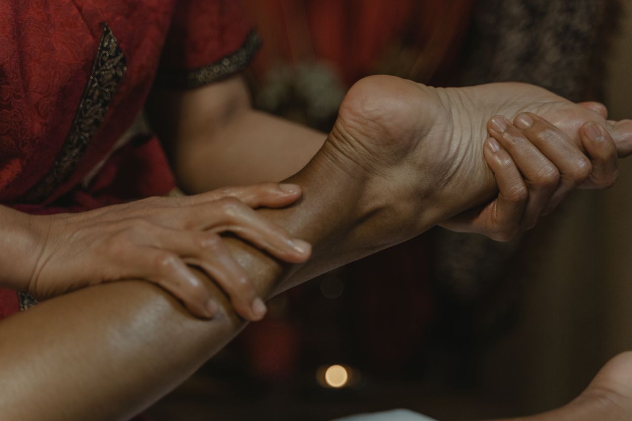 Home Close-up of a soothing foot massage at a spa, promoting relaxation and wellness.