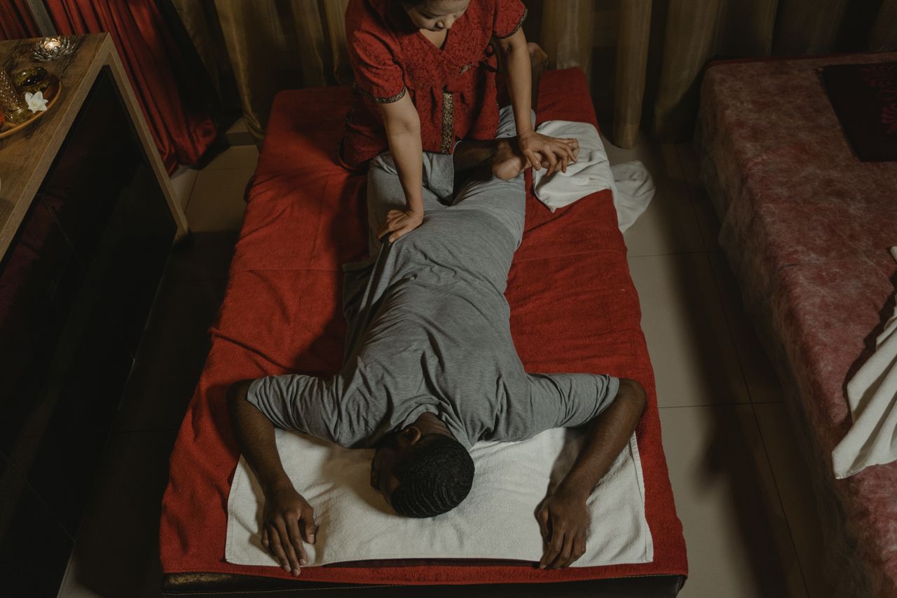 Home Relaxing Thai massage in a serene spa setting, enhancing wellness and relaxation.
